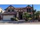 Charming two-story home with a two-car garage and desert landscaping at 6928 W Oraibi Dr, Glendale, AZ 85308