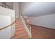 Light-filled foyer with wooden staircase, hardwood floors, and high ceilings at 6928 W Oraibi Dr, Glendale, AZ 85308