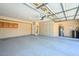 Spacious garage with built in cabinets and epoxied floors for clean organized storage at 6928 W Oraibi Dr, Glendale, AZ 85308
