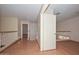 Bright hallway features wood railing, natural light, and neutral walls creating a seamless flow to other areas at 6928 W Oraibi Dr, Glendale, AZ 85308