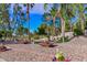 Park with seating area, pond with waterfall and beautiful landscaping perfect for relaxation at 6928 W Oraibi Dr, Glendale, AZ 85308