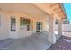 Covered patio showcases the backyard with views of the low maintenance landscaping at 6928 W Oraibi Dr, Glendale, AZ 85308