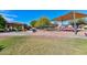 Community playground featuring covered seating, play structures, and green space for outdoor activities at 6928 W Oraibi Dr, Glendale, AZ 85308