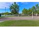 Community recreation area with a sand volleyball court near park and green spaces at 6928 W Oraibi Dr, Glendale, AZ 85308