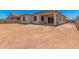 The backyard of this home has a covered patio area and has plenty of room for landscaping at 6952 E Brushy Bill Rd, San Tan Valley, AZ 85143