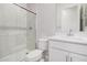 Modern bathroom features white marbled shower, toilet, and vanity with a single sink at 6952 E Brushy Bill Rd, San Tan Valley, AZ 85143