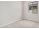 This simple bedroom has neutral walls and a small window for natural light at 6952 E Brushy Bill Rd, San Tan Valley, AZ 85143