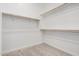 Walk-in closet with carpet and shelving for ample storage at 6952 E Brushy Bill Rd, San Tan Valley, AZ 85143