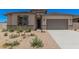 Charming single-story home with desert landscaping, gray trim, and a two-car garage at 6952 E Brushy Bill Rd, San Tan Valley, AZ 85143