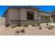 Attractive desert-landscaped front yard featuring low shrubs and a partial block wall at 6952 E Brushy Bill Rd, San Tan Valley, AZ 85143