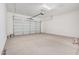 Spacious two car garage with automatic door and clean, painted concrete floor at 6952 E Brushy Bill Rd, San Tan Valley, AZ 85143