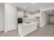 Bright kitchen features white cabinets, stainless steel appliances, and a center island at 6952 E Brushy Bill Rd, San Tan Valley, AZ 85143