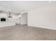 Open-concept living area featuring neutral tile flooring and bright, modern finishes at 6952 E Brushy Bill Rd, San Tan Valley, AZ 85143