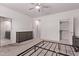 Neutral bedroom with a ceiling fan, carpeted floors, and a closet at 7086 W Spur Dr, Peoria, AZ 85383