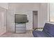 Bedroom featuring a sliding closet door, blue chair, and a cabinet with three drawers at 7086 W Spur Dr, Peoria, AZ 85383