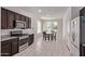Kitchen with stainless steel appliances, granite countertops, and dark wood cabinetry at 7086 W Spur Dr, Peoria, AZ 85383