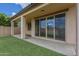 Relaxing covered patio area with a grassy yard, perfect for outdoor enjoyment at 8518 S 8Th Ln, Phoenix, AZ 85041