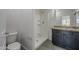 Bathroom featuring shower and granite-topped vanity at 8518 S 8Th Ln, Phoenix, AZ 85041