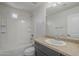Bathroom showcasing a vanity with ample counter space, bathtub, and an enclosed shower at 8518 S 8Th Ln, Phoenix, AZ 85041