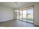 Dining room with sliding glass doors and a modern chandelier at 8518 S 8Th Ln, Phoenix, AZ 85041