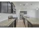 Kitchen with granite countertops, stainless steel appliances and dark wood cabinets at 8518 S 8Th Ln, Phoenix, AZ 85041