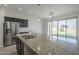 Kitchen island with granite countertops and stainless steel appliances at 8518 S 8Th Ln, Phoenix, AZ 85041