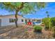 Spacious backyard showcasing a pool, patio with grill, and desert landscaping around the house at 8730 E Montecito Ave, Scottsdale, AZ 85251
