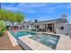 Gorgeous backyard oasis with pool, spa, BBQ, and outdoor dining area at 8730 E Montecito Ave, Scottsdale, AZ 85251