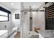 Modern bathroom featuring a walk-in shower, and a sleek granite vanity at 8730 E Montecito Ave, Scottsdale, AZ 85251