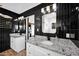 Modern bathroom with double vanities, granite countertops, and sleek fixtures at 8730 E Montecito Ave, Scottsdale, AZ 85251