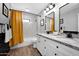 Beautiful bathroom with a double granite vanity, tub, and modern fixtures at 8730 E Montecito Ave, Scottsdale, AZ 85251