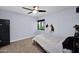 Cozy bedroom featuring neutral walls, carpet, and natural light through a window at 8730 E Montecito Ave, Scottsdale, AZ 85251