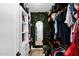 Walk-in closet with custom shelving, a vanity area, and ample storage at 8730 E Montecito Ave, Scottsdale, AZ 85251