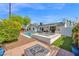 Outdoor firepit area with seating, pavers, and potted plants for cozy backyard gatherings at 8730 E Montecito Ave, Scottsdale, AZ 85251