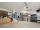 Clean garage featuring epoxy floors and organized storage systems, including cabinets at 8730 E Montecito Ave, Scottsdale, AZ 85251