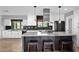 Spacious kitchen featuring a center island with seating, stainless steel appliances, and modern cabinetry at 8730 E Montecito Ave, Scottsdale, AZ 85251