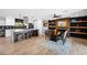 Bright, open kitchen with a center island, modern appliances, and a dining area with a fireplace at 8730 E Montecito Ave, Scottsdale, AZ 85251