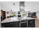 Large kitchen island features modern appliances with an open concept to the living areas at 8730 E Montecito Ave, Scottsdale, AZ 85251