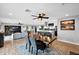 Open-concept living room with views to the kitchen and access to backyard at 8730 E Montecito Ave, Scottsdale, AZ 85251