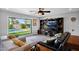 Bright living room features an oversized window and a beautiful backyard view at 8730 E Montecito Ave, Scottsdale, AZ 85251