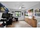 Well-lit office space with modern décor, a large flat-screen TV, and an exercise bike at 8730 E Montecito Ave, Scottsdale, AZ 85251