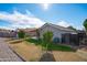 Expansive backyard with lush green grass and a playground for outdoor enjoyment at 8828 E Des Moines St, Mesa, AZ 85207