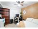 Bedroom with desk and bookshelves is bright and functional at 8828 E Des Moines St, Mesa, AZ 85207