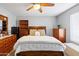 Spacious bedroom with a ceiling fan, carpet flooring, and lots of natural light at 8828 E Des Moines St, Mesa, AZ 85207