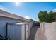 Side yard with a storage shed and gravel landscaping for low maintenance at 8828 E Des Moines St, Mesa, AZ 85207