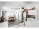 Bright kitchen overlooking a dining area with a modern refrigerator and white cabinets at 8828 E Des Moines St, Mesa, AZ 85207