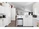This kitchen features white cabinets, stainless steel appliances, and granite countertops at 8828 E Des Moines St, Mesa, AZ 85207