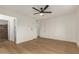 Bedroom with laminate floors and multiple doorways at 908 W Mohawk Ln, Phoenix, AZ 85027