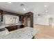 Kitchen features granite countertops, stainless steel appliances, and dark wood cabinets at 908 W Mohawk Ln, Phoenix, AZ 85027