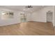 Bright living room featuring wood floors and sliding glass doors to the backyard at 908 W Mohawk Ln, Phoenix, AZ 85027